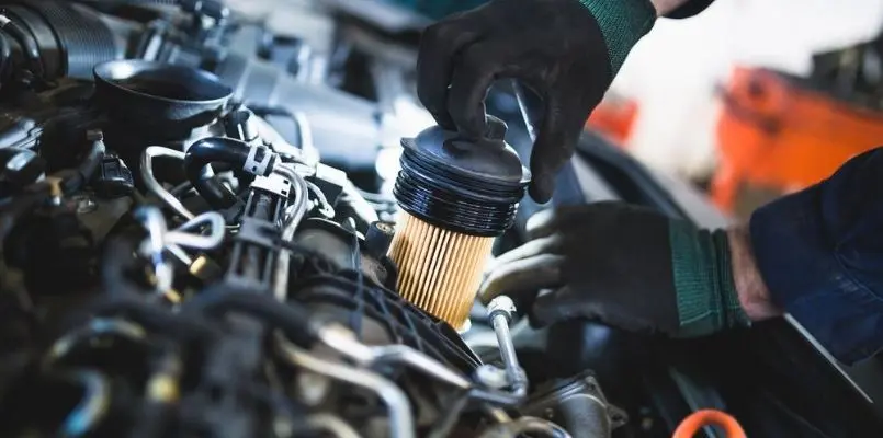 Changing an oil filter to make your car keep running smoothly