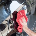 Waxing my car by hands in my garage