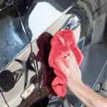 Waxing my car by hands in my garage