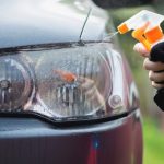 Cleaning cloudy headlight outside of my garage using a kit