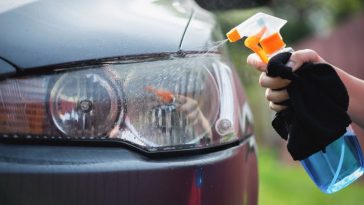 Cleaning cloudy headlight outside of my garage using a kit
