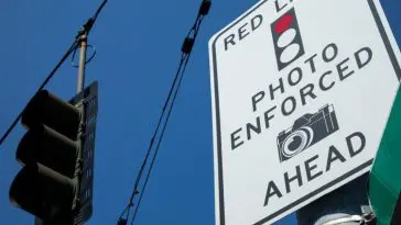 You will be told that there will be a red light camera ahead of you