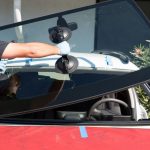 Changing a craked windshield outside of my garage and pay the repair price