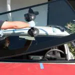 Changing a craked windshield outside of my garage and pay the repair price