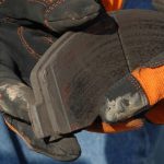 Checking the thickness of your brake pads at an auto repair shop