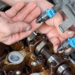 Where are my fuel injector located? I'll need to remove them