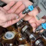 Where are my fuel injector located? I'll need to remove them