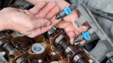 Where are my fuel injector located? I'll need to remove them