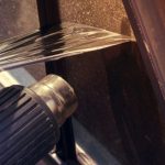 Taking off my old window tint with a heat gun in my garage