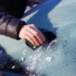 Getting rid of ice on my windshield when I go to work