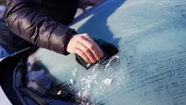 Getting rid of ice on my windshield when I go to work