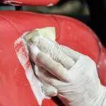 Cleaning my leather car seats with a cleaner while having a spare time