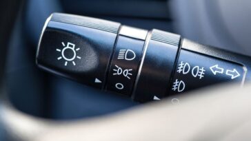 How can I tell if my headlights are on high beam or low beam?