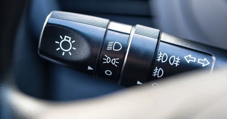 How can I tell if my headlights are on high beam or low beam?