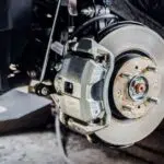 What should I use to compress the brake caliper? Are there any tools that I will have to use?
